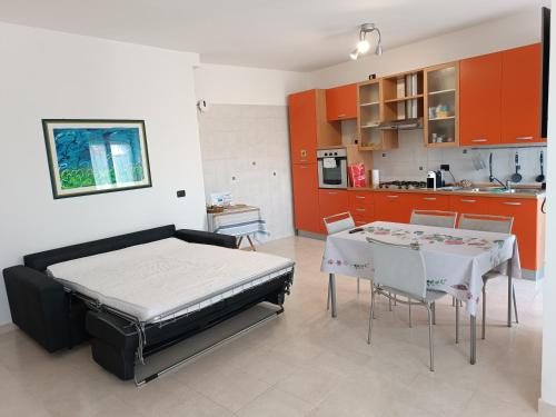 a bedroom with a bed and a table and chairs at Pirandello45 - zona universitaria in Campobasso