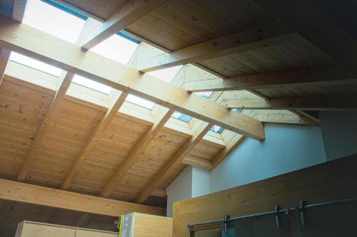 a wooden ceiling in a room with a window at EMMA´s Chalet in Mayrhofen