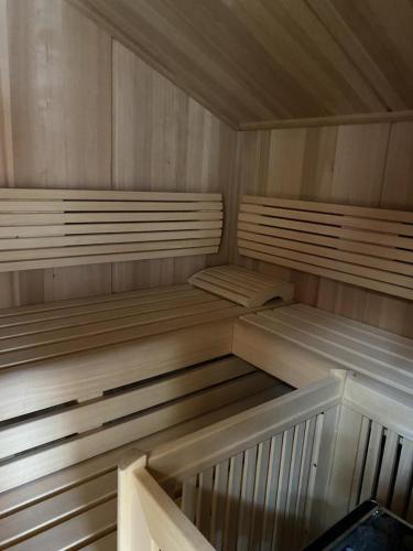 a wooden sauna with wooden shelves at EMMA´s Chalet in Mayrhofen