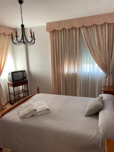 Katil atau katil-katil dalam bilik di Apartamento La Via