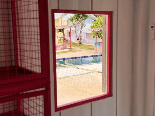 a view of a tennis court through a window at Slumber Resort Koh Chang in Trat