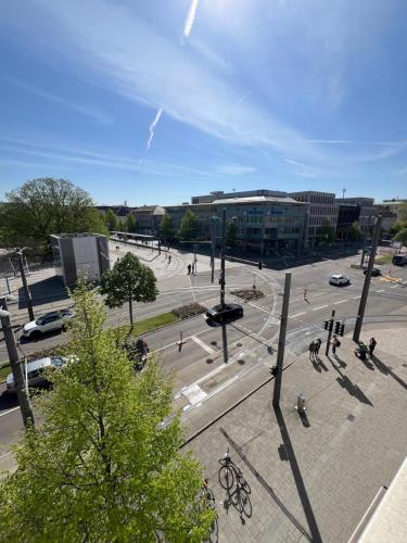 a city square with a street with people and cars at City Unterkunft 3 in Heilbronn