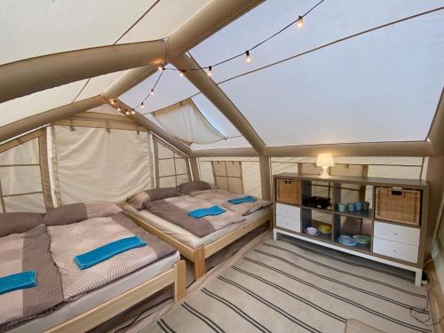 a bedroom with two beds on a boat at Mara Camping Mobile Homes in Liptovský Trnovec
