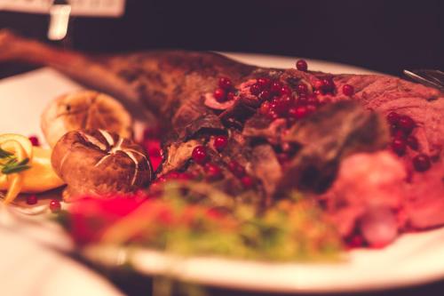 a plate of food sitting on a table at Spidsbergseter Resort Rondane in Venabygd
