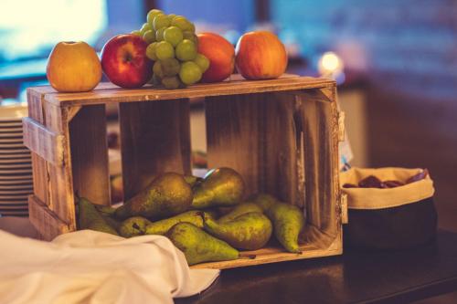 a display of fruits and vegetables on a table at Spidsbergseter Resort Rondane in Venabygd