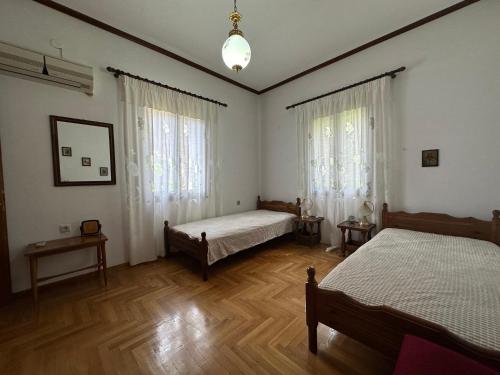 Ένα ή περισσότερα κρεβάτια σε δωμάτιο στο Tasos Apartment