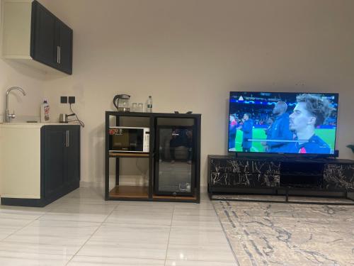 TV i/ili multimedijalni sistem u objektu الرياض