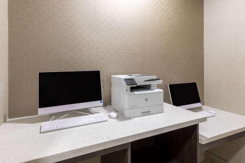 a desk with a computer and a printer on it at La Quinta by Wyndham New Braunfels in New Braunfels