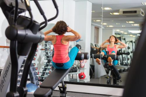 two women working out in a gym at Bedford Lodge Hotel & Spa in Newmarket