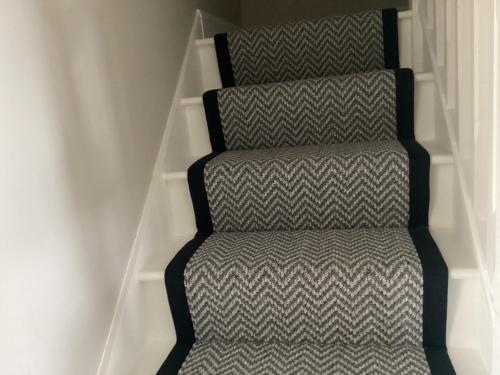 a set of stairs with a grey and white pattern at 4 Cois Glaisin View in Kilcarn