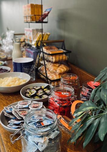 a table topped with plates of food and other foods at Middle House - Wensleydale, Yorkshire Dales in Askrigg