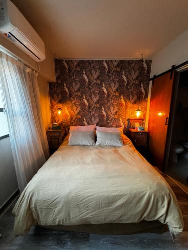 En eller flere senge i et værelse på Cálido y céntrico departamento!