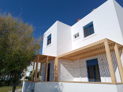 a house under construction with a blue sky at Ocean Palace in Prasonisi