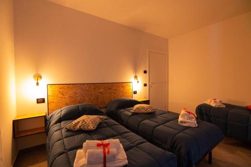 Postel nebo postele na pokoji v ubytování B&B Collemaggio
