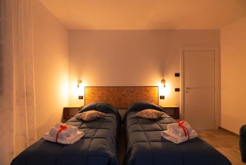 Postel nebo postele na pokoji v ubytování B&B Collemaggio