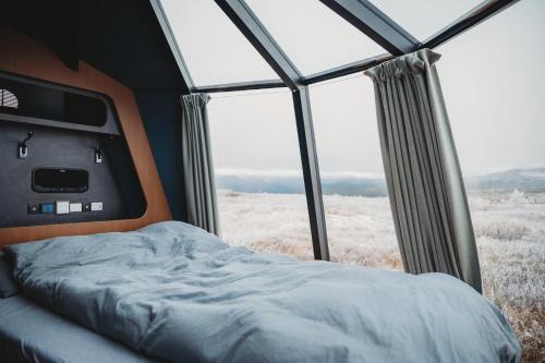 Una cama o camas en una habitación de Smuksjøseter Fjellstue
