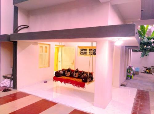 a model of a living room with cows on a bed at Chitrakut Bungalows in Dwarka