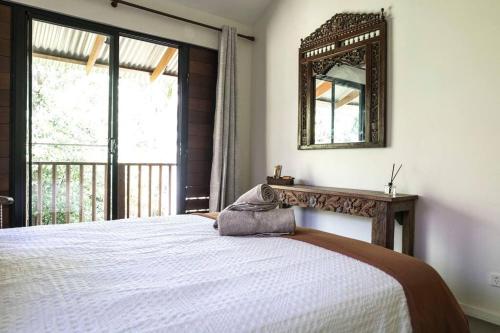 Postelja oz. postelje v sobi nastanitve Warung Guest House Byron Bay