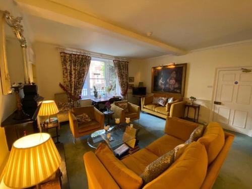 a living room with a couch and chairs and a table at The Casterbridge in Dorchester