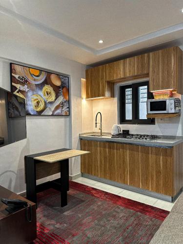 Kuchyň nebo kuchyňský kout v ubytování Klik Klak Appart Hotel