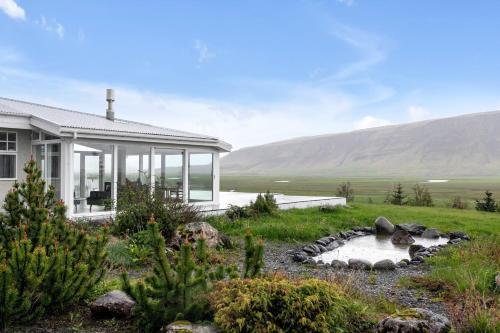a home with a view of a mountain at Himri the mountain villa in Mosfellsbær