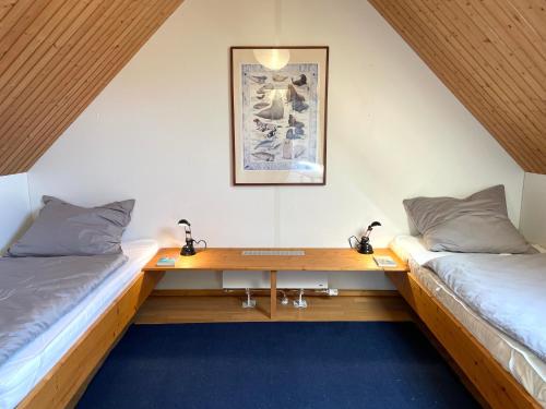 Postel nebo postele na pokoji v ubytování Austernfischer Prerow - Schönes Ferienhaus in Toplage mit großem Garten für Familie und Freunde