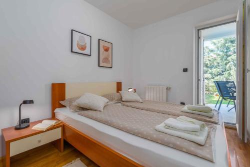 a bedroom with a large bed and a window at Apartment in Porec/Istrien 10331 in Poreč