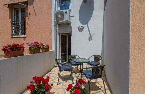 a patio with a table and chairs on a balcony at Ferienhaus für 4 Personen ca 47 qm in Crikvenica, Kvarner Bucht Crikvenica und Umgebung in Crikvenica