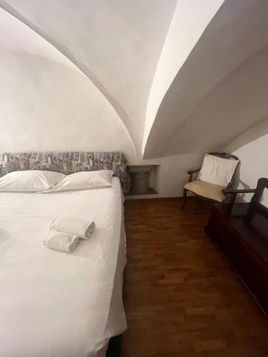 Tempat tidur dalam kamar di Santo Spirito Apartment