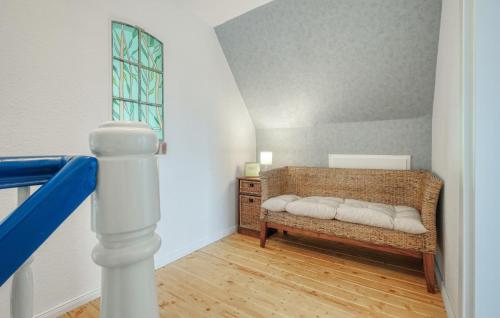 a room with a bench with pillows on it at 2 Bedroom Lovely Home In Galmsbüll in Galmsbüll