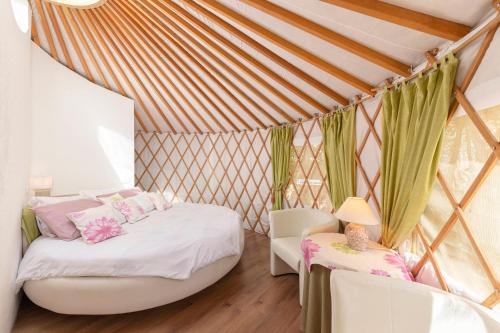 Postel nebo postele na pokoji v ubytování L.stile Glamping