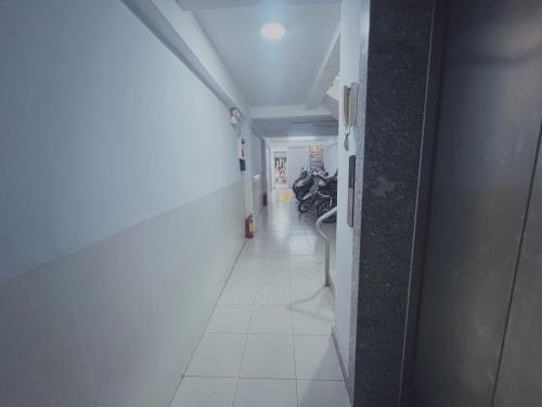 a hallway with a room with a motorcycle in it at Kevin homestay in Ho Chi Minh City
