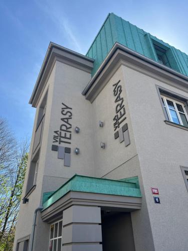 a building with words on the side of it at Apartmány Vila Terasy in Liberec