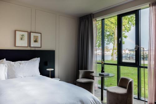 Katil atau katil-katil dalam bilik di Pillows Luxury Boutique Hotel aan de IJssel