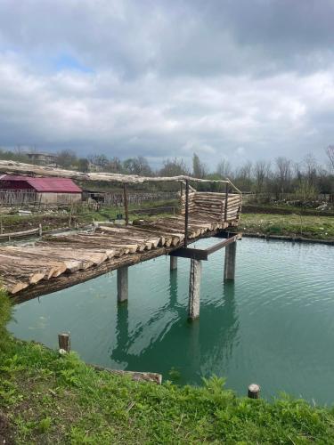 a wooden bridge over a body of water at Kirta in Gordi