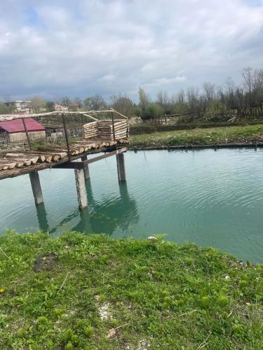 a wooden bridge over a body of water at Kirta in Gordi