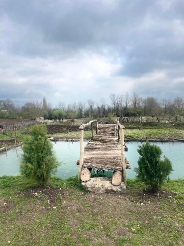 a wooden bridge over a body of water at Kirta in Gordi