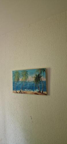 una pintura de palmeras en una pared en Location ideal J.o du 15 juin au 15 Aout., en Chaville