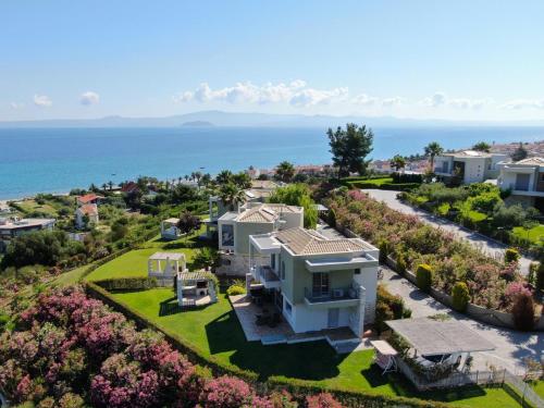 an aerial view of a house with the ocean in the background at TAMARI Luxury Villa - Miramare in Pefkohori