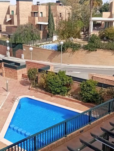 a swimming pool on the balcony of a building at Arrabassada in Tarragona