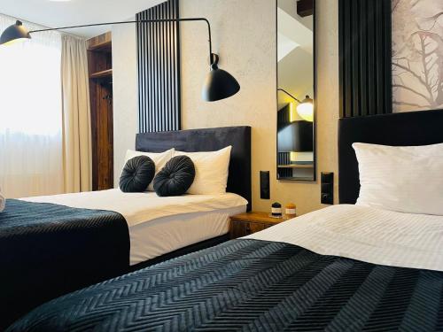 Postel nebo postele na pokoji v ubytování Hotel Millennium