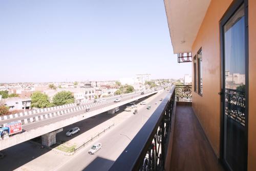 a view of a highway from a balcony of a building at Hotel East Wood Amritsar in Amritsar