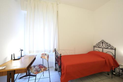 Ένα ή περισσότερα κρεβάτια σε δωμάτιο στο Casa Rosso Melograno