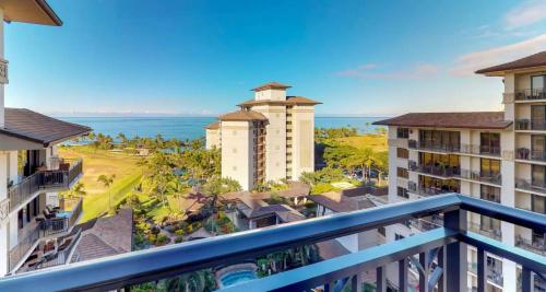 a view of the ocean from a balcony at a resort at Ko Olina Beach Villas O1006 in Kapolei