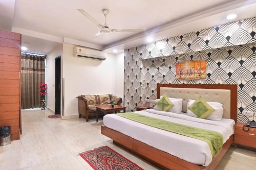 a bedroom with a large bed in a room at Hotel Excellency in New Delhi