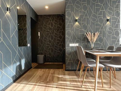 a dining room with a table and chairs at Fashion Apartment in Narva