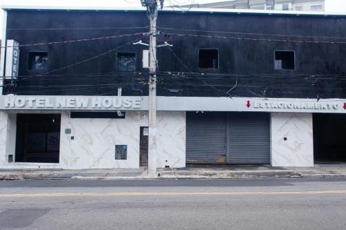 a hotel new house on the side of a street at Hotel New House in Sao Paulo