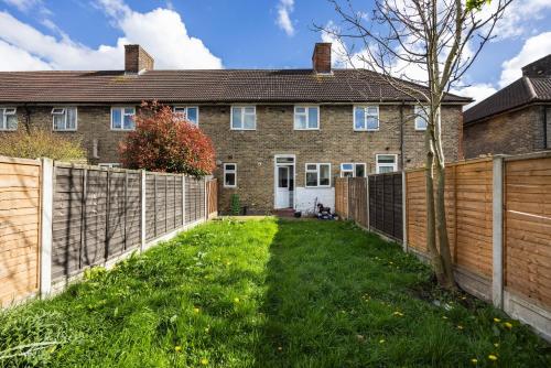 a fence in front of a house at DAGENHAM 3 and 4 BEDROOMS 2BATHS with Parking in Dagenham