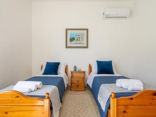 Ένα ή περισσότερα κρεβάτια σε δωμάτιο στο casa fronte spiaggia
