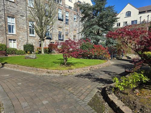a walkway in front of a brick building at Gracian OMB Dublin Apartment in Dublin